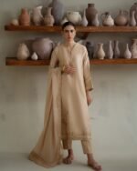 PAKISTANI BRUNETTE BEIGE DRESS.